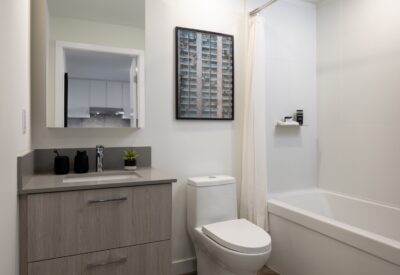 Bathroom with vanity, quartz counter and soaker tub in an Abode rental home