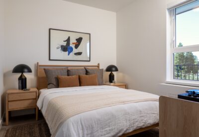 Bedroom with large window and natural light in an Abode rental home